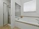 Bright bathroom featuring a soaking tub with tile surround and a glass-enclosed shower at 3001 Lake Huron Ln, Tavares, FL 32778