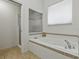 Relaxing bathroom featuring a soaking tub with tile surround and a glass-enclosed shower at 3001 Lake Huron Ln, Tavares, FL 32778