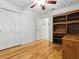 Bright bedroom featuring wood floors, a ceiling fan, and a large closet at 3001 Lake Huron Ln, Tavares, FL 32778