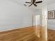 This bedroom has wood floors, ceiling fan and access to a bathroom at 3001 Lake Huron Ln, Tavares, FL 32778