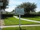 Community bocce ball courts surrounded by lush green lawns and landscaping for outdoor enjoyment at 3001 Lake Huron Ln, Tavares, FL 32778