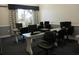 Community computer room featuring multiple workstations, comfortable chairs, and natural lighting at 3001 Lake Huron Ln, Tavares, FL 32778