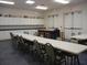 Spacious craft room with ample tables, seating, and storage for creative activities, perfect for resident enjoyment at 3001 Lake Huron Ln, Tavares, FL 32778