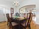 Charming dining room with adjacent living areas and an elegant chandelier at 3001 Lake Huron Ln, Tavares, FL 32778