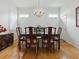 Light-filled dining room features a chandelier and windows for bright light at 3001 Lake Huron Ln, Tavares, FL 32778
