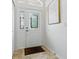 Bright entryway with decorative glass door and sidelights, complemented by tile flooring and elegant wall decor at 3001 Lake Huron Ln, Tavares, FL 32778