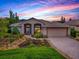 Charming single-story home featuring arched windows, two-car garage and a beautifully landscaped front yard at 3001 Lake Huron Ln, Tavares, FL 32778