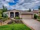 Charming single Gathering home with a two car garage, a manicured lawn and beautiful landscaping at 3001 Lake Huron Ln, Tavares, FL 32778