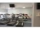 Well-equipped fitness center with treadmills, elliptical machines, and mirrors for resident use at 3001 Lake Huron Ln, Tavares, FL 32778