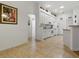Spacious kitchen with white cabinetry and open layout to other rooms at 3001 Lake Huron Ln, Tavares, FL 32778