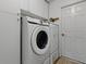 Modern laundry room with high-efficiency washer and dryer, maximizing space at 3001 Lake Huron Ln, Tavares, FL 32778