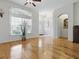 Bright living area with hardwood floors, large windows, and elegant arched doorways at 3001 Lake Huron Ln, Tavares, FL 32778