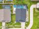 Aerial view of home showcasing a screened-in pool, lush landscaping, and well-maintained yard at 310 Ballyshannon Dr, Davenport, FL 33897