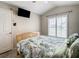 This room features a ceiling fan and a large window with shutters, allowing for ample natural light at 310 Ballyshannon Dr, Davenport, FL 33897