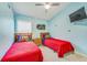 Bedroom showcases a Toy Story theme with blue walls, hanging decor, and matching comforter sets at 310 Ballyshannon Dr, Davenport, FL 33897