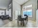 Dining room with vaulted ceiling, and large windows at 310 Ballyshannon Dr, Davenport, FL 33897