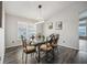 Inviting dining room featuring modern light fixture and stylish decor with hardwood flooring at 310 Ballyshannon Dr, Davenport, FL 33897