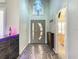 Bright entryway featuring a unique modern front door and eye-catching black and white tile flooring at 310 Ballyshannon Dr, Davenport, FL 33897
