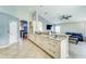 Bright kitchen with modern white cabinets and stainless steel pulls and granite countertop at 310 Ballyshannon Dr, Davenport, FL 33897