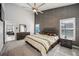 Spacious bedroom featuring high ceilings, a ceiling fan, and ensuite bathroom for added privacy at 310 Ballyshannon Dr, Davenport, FL 33897