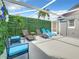 Serene patio area with lounge chairs and lush green wall providing a private escape at 310 Ballyshannon Dr, Davenport, FL 33897