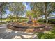 Community playground with slides, climbing structures, and shaded seating areas at 310 Ballyshannon Dr, Davenport, FL 33897