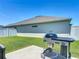 Spacious backyard with BBQ grill, perfect for outdoor cooking and entertaining at 3138 Aurea Pl, The Villages, FL 32163