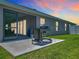 Backyard patio with built in BBQ grill and sliding glass doors to the home at 3138 Aurea Pl, The Villages, FL 32163
