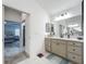 Bathroom featuring a vanity with a sink, a mirror, and an entrance to the bedroom at 3138 Aurea Pl, The Villages, FL 32163