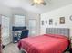 Comfortable bedroom with neutral walls, and a large window at 3138 Aurea Pl, The Villages, FL 32163
