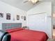 Cozy bedroom featuring a double door closet at 3138 Aurea Pl, The Villages, FL 32163