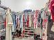 Organized walk-in closet with hanging clothes, shelves, and shoe racks for ample storage at 3138 Aurea Pl, The Villages, FL 32163