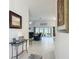Bright entryway with white tile floors leading into a living space with patio access at 3138 Aurea Pl, The Villages, FL 32163