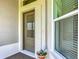Front door detail with decorative pot and textured walls at 3138 Aurea Pl, The Villages, FL 32163