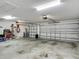 Spacious three car garage featuring two garage doors and ample storage space at 3138 Aurea Pl, The Villages, FL 32163