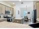Well-equipped kitchen featuring granite countertops, stainless steel appliances, and breakfast nook at 3138 Aurea Pl, The Villages, FL 32163