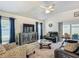 Comfortable living room showcasing elegant furnishings, a ceiling fan and stylish decor at 3138 Aurea Pl, The Villages, FL 32163