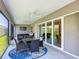 Screened patio with outdoor dining and seating area, perfect for entertaining at 3138 Aurea Pl, The Villages, FL 32163