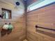 Modern shower featuring wood-look tiling, built-in niche, and rainfall shower head at 3138 Aurea Pl, The Villages, FL 32163