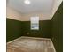 Bedroom with neutral carpet, two-toned olive and neutral colored walls and window with blinds at 3194 Bayou Ln, Tavares, FL 32778