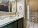 Bathroom featuring a vanity with decorative accents and a tiled floor at 32521 W Golf Ct, Leesburg, FL 34748