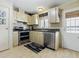 A cozy kitchen showcases stainless steel appliances and ample cabinet space at 32521 W Golf Ct, Leesburg, FL 34748