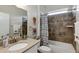 Bathroom with tile shower and vanity at 3677 Arlington Ridge Blvd, Leesburg, FL 34748