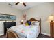 Cozy bedroom features coastal decor and a comfortable bed at 3677 Arlington Ridge Blvd, Leesburg, FL 34748