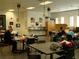 Classroom with tables, chairs, and art supplies for creative learning activities at 3677 Arlington Ridge Blvd, Leesburg, FL 34748