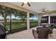 Screened lanai with scenic views of the golf course, perfect for outdoor relaxation at 3677 Arlington Ridge Blvd, Leesburg, FL 34748