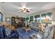 Spacious living room with large windows, comfortable seating, and stylish decor at 3677 Arlington Ridge Blvd, Leesburg, FL 34748
