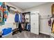Walk-in closet with shelving and hanging rods for ample storage at 3677 Arlington Ridge Blvd, Leesburg, FL 34748