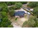 Aerial shot showcasing the property's layout, expansive backyard, and convenient proximity to nearby amenities at 39812 French Rd, Lady Lake, FL 32159