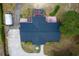 Overhead view highlighting the home's unique roof design, well-manicured landscaping, and expansive backyard at 39812 French Rd, Lady Lake, FL 32159